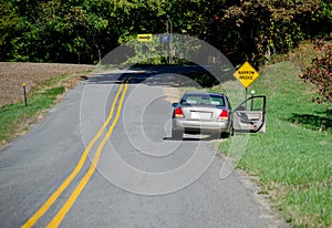 Abandoned car on the side of the road