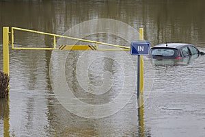 Abandoned Car Submerged In Flood Water In Parking Lot In Oxfordshire UK January 2024