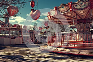 abandoned carnival fairground adorned with Valentine\'s Day decorations