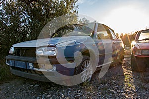 Abandoned cars in the field