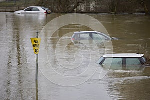 Abandoned Cars Submerged In Flood Water In Parking Lot In Oxfordshire UK January 2024