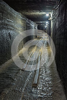 Abandoned cart railway in a salt mine tunnel