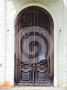 Abandoned castle front double wooden doors