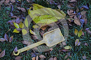 Abandoned child`s toy spade