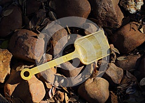 Abandoned child`s toy spade