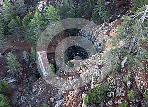 Abandoned chromite mine in forest, aerial view