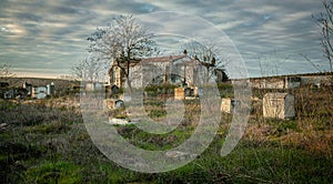 Abandoned church ruin and cemetery overgrown landscape