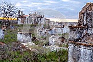 Abandoned church ruin and cemetery overgrown landscape