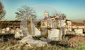Abandoned church ruin and cemetery overgrown landscape photo