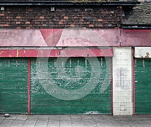 Abandoned closed shop with decaying facade