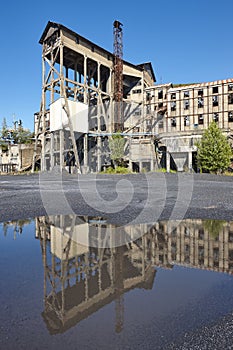 Abandoned coal factory. Industrial rusted machinery. Polluted la