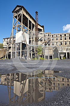 Abandoned coal factory. Industrial rusted machinery. Polluted landscape. Renewable