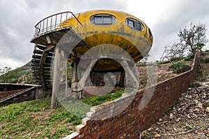 Abandoned colorful pod-styled building.
