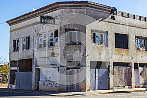 Abandoned Commercial Building With Boarded Up Doors