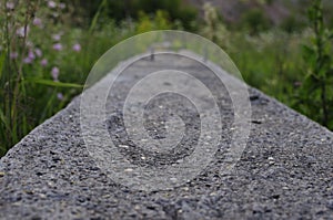 Abandoned concrete building construction site. Concrete slab of building foundation. Steel rebar of concrete piles, foundation