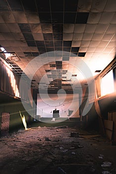 Abandoned and damaged interior of a movie theatre with stage