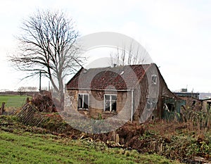 Abandoned and decayed farm house waiting demolishment at the Gouwe Park in Moordrecht, the netherlands.