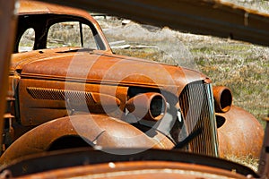 Abandoned decaying vintage car