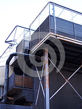 Abandoned derelict industrial building with rusting steel girders tanks and pipes