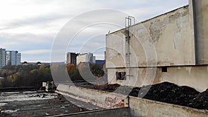 Abandoned and destroyed building, zoom in. Destruction of objects, buildings and constructions. Drone footage, crane shot