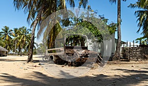 Abandoned and destroyed car in Mocimboa da Praia in Cabo Delgado, Mozambique photo