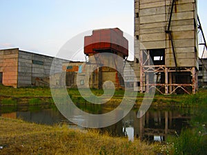 Abandoned destroyed equipment of a salt mine in a field