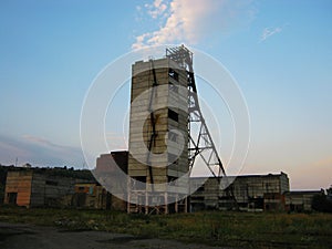 Abandoned destroyed equipment of a salt mine in a field