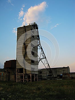 Abandoned destroyed equipment of a salt mine in a field