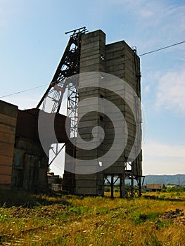 Abandoned destroyed equipment of a salt mine in a field