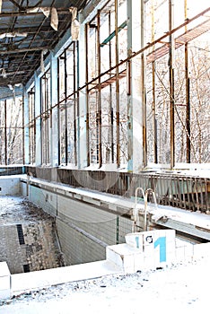 The Abandoned and destroyed pool in a sports complex in Pripyat after the Chernobyl accident in Ukraine in 1986