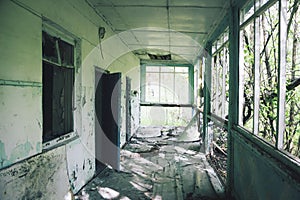 Abandoned destroyed tourist recreation center in a mixed forest