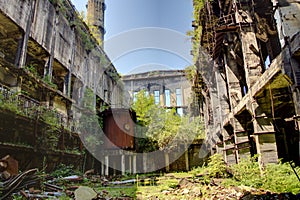 Abandoned, destroyed by war and overgrown machinery of Tkvarcheli power plant