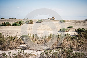 Abandoned dirty shoreline of the Salton Sea in Bombay Beach California on a sunny day