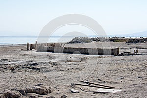 Abandoned dirty shoreline of the Salton Sea in Bombay Beach California on a sunny day