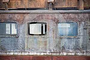 Abandoned distinctive dormer windows in close up