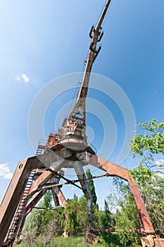 Abandoned dock cranes in Prypiat, Chernobyl exclusion Zone. Chernobyl Nuclear Power Plant Zone of Alienation in Ukraine