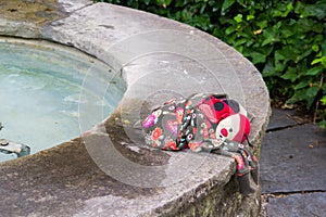 Abandoned doll on a playing ground
