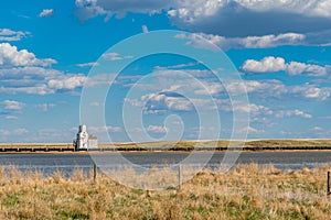 An abandoned elevator across the water in Sanctuary, Saskatchewan