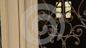 Abandoned empty house with chain padlock on the entrance door, forgotten museum