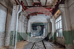 Abandoned empty train depot with old rusty bridge crane