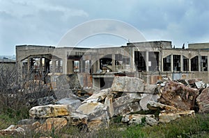 Abandoned factory exterior and cloudy sky