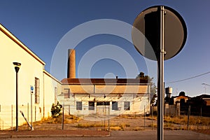 abandoned factory facade whit closed windows, Italy photo