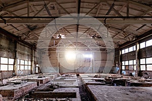 Abandoned factory. Large empty ruined industrial hall