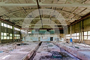 Abandoned factory. Large empty ruined industrial hall