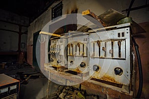 Abandoned factory at night. Old rusty machinery