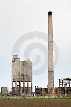 Abandoned factory with smokestack