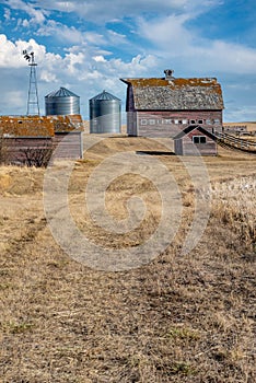 Abandoned farm buildings on the prairies in Saskatchewan, Canada.