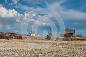 Abandoned farm buildings on the prairies in Saskatchewan, Canada.