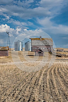 Abandoned farm buildings on the prairies in Saskatchewan, Canada.