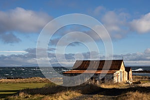 Abandoned farm house and Ocean, Iceland